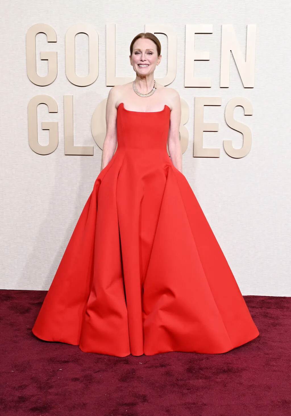 Julianne Moore in a typical feminine red gown