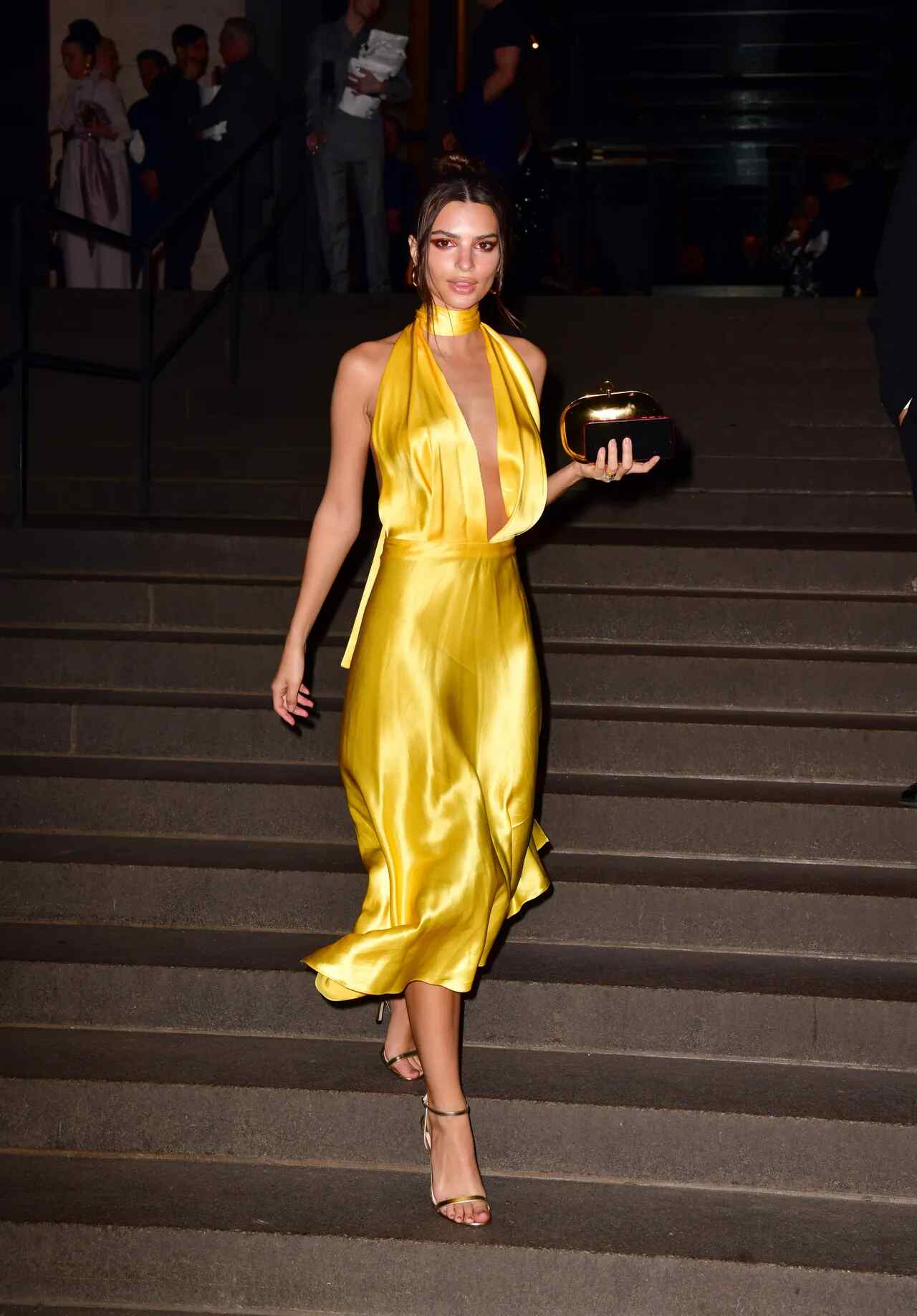 EmRata attended Marc Jacobs and Charly Defrancesco’s wedding in a silky, high-shine yellow dress in April 2019