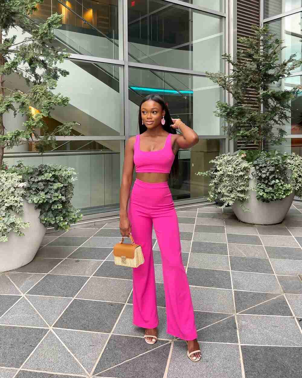  Women standing with a cute and subtle clutch bag